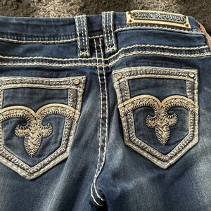 Two pairs of almost like new Rock Revival skinny jeans size 27 inseam 31.